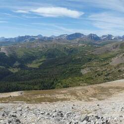 Mountainous background behind while Vicki is slogging up Mt Bourgeau