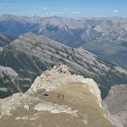 Vicki tiny against the gigantic mountains