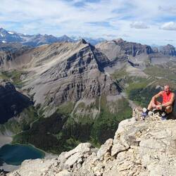 Doug on top of Mt Bourgeau with Bourgeau Lake below