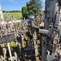 Close up of crosses, rosaries, and icons at The Hill of Crosses