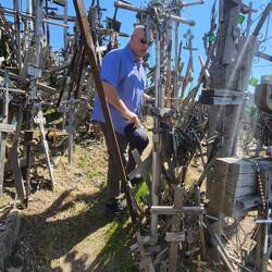 Scott preparing to "plant" our family crosses at The Hill of Crosses