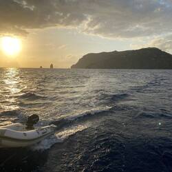 Towing the lost dinghy to Vulcano