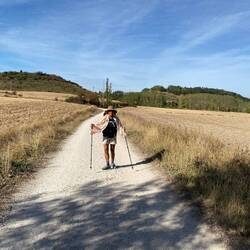 Hiking through harvested grain fields. Scarf provides sun protection.