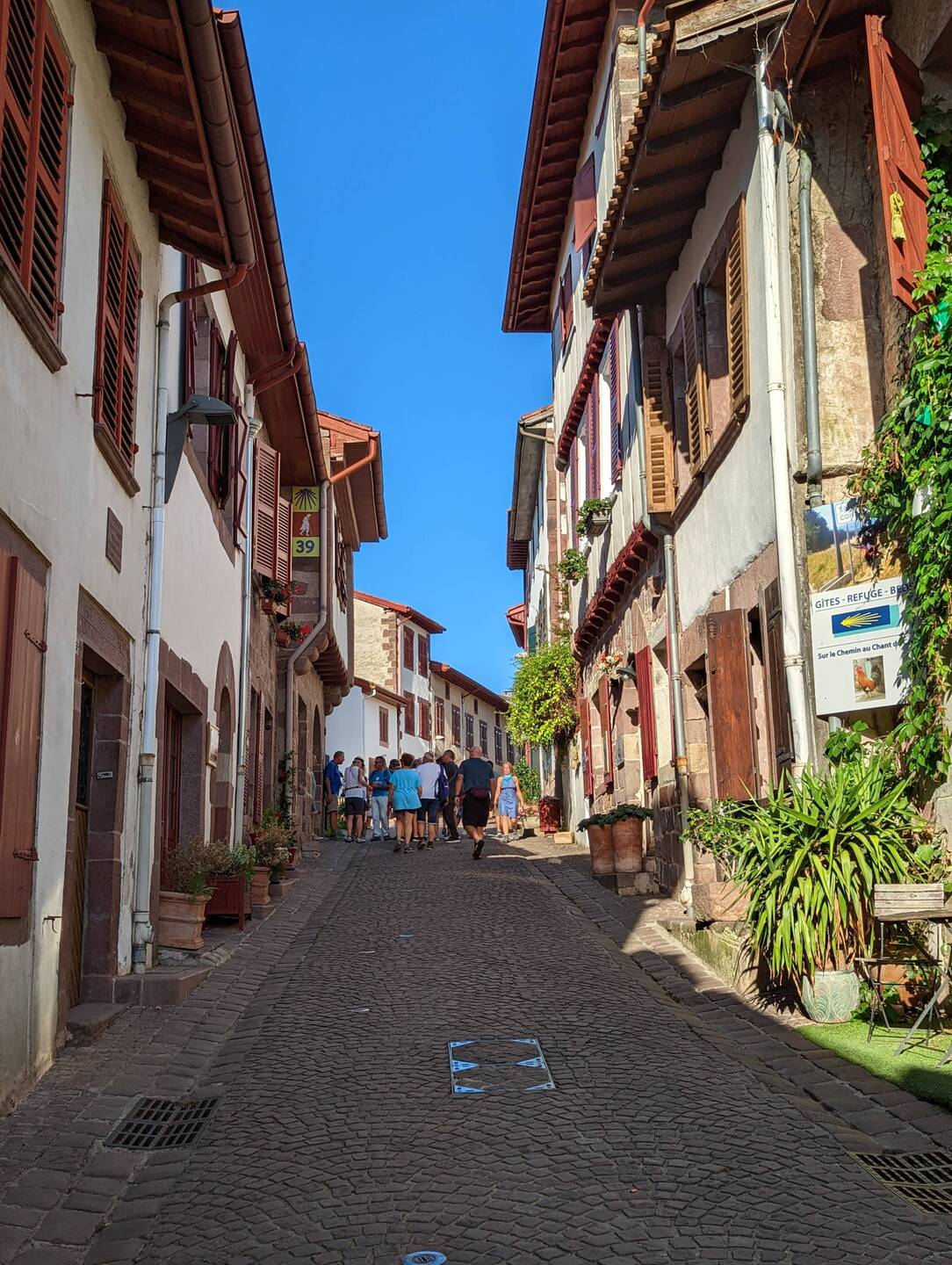 Looking up Rue de la Citadelle toward pilgrim office