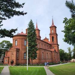 Scott and Vincas walking toward the back of The back of St. Peter and Paul's Church in Panevėžys
