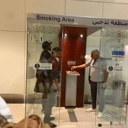 Abu Dhabi smoking sections. Little glass cubes they stand in