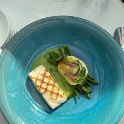 Grilled Sea Bass with beans, anchovies and harchard