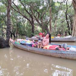 One of the floating shops. Many of the women had their children with them.