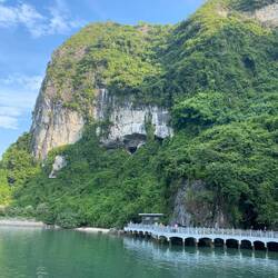 The hole in the cliff is the entrance to the cave