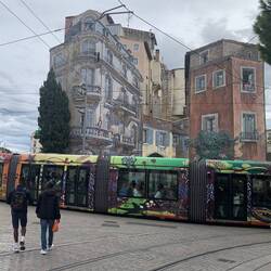 Buildings painted in 3D, and colourful trams - what a scene