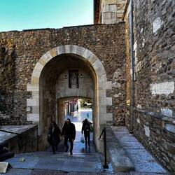 Walking through an old arch or "puerta" to reach our new hotel.
