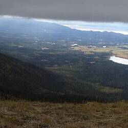 A low thick cloud ceiling when overlooking Flathead lake and valley