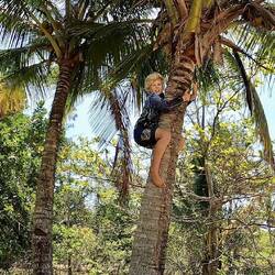 Lachie collecting coconut on the island