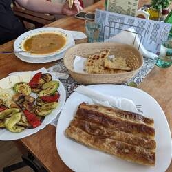 Burek (bottom), Grilled vegetables (left), and veal bean soup (top)