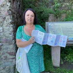 Florence proudly shows us her fully stamped passport for the