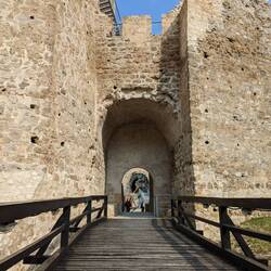 Gate to the fortress that used to be a highway tunnel. Notice the damage on the archway from buses.
