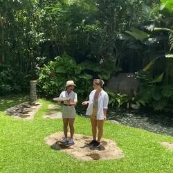 Jordan volunteering - falcons eating off the tray on her head
