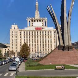 The Communist Party headquarters. Where the current statue is, there used to be a statue of Stalin.