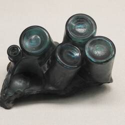 Bottles melted together from the blast