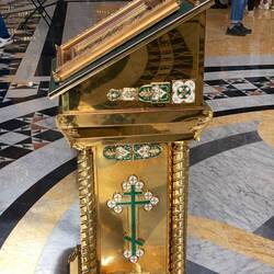 A prayer station. People would come up to this, cross themselves 3 times then kiss the glass top.