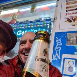Grabbing a beer outside of a kiosk