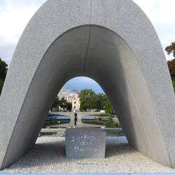 Looking through commemorative arch to eternal flame and A-dome