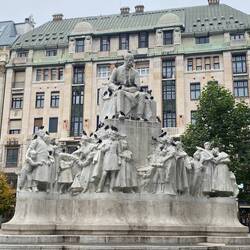 Statue that was crowded with pigeons.