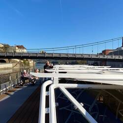 Under the bridge and sailing away.
