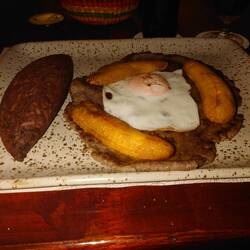 Beef tenderloin breaded and pounded thin served with black beans and rice “Tacu Tacu”,fried banana