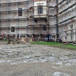 Archeologists working in the courtyard before a restoration