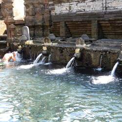 Devotees participating in the purification ritual, Tirta Empul.