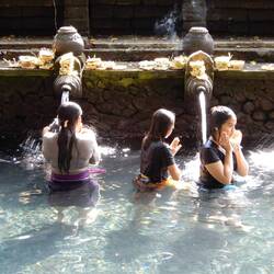 Devotees participating in the purification ritual, Tirta Empul.