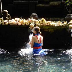 Devotees participating in the purification ritual, Tirta Empul.