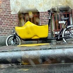 Bike with a cute kids cargo carriage in the shape of a clog
