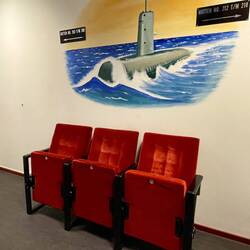 Each floor had art work and cinema style chairs - a place to wait for the slow lift