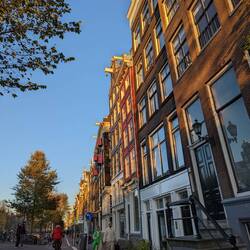 Slightly crooked houses with pulleys at the top. Were originally warehouses.