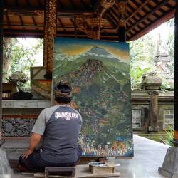 Painter working on piece depicting a festival at Bersakih.