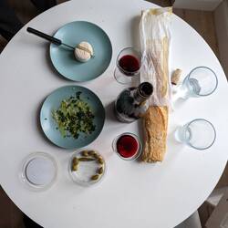 A DIY spread of wine and a baguette