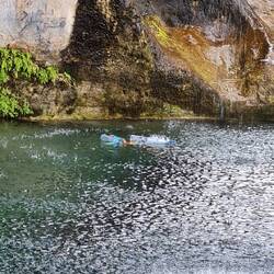 Plastic bottles floating in the clearest mountain river I have ever seen