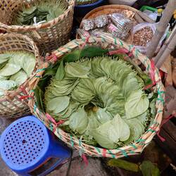 Scenes from Daryingon market. I believe these are betel nut leaves.