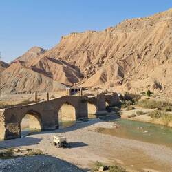 Old Sassanid bridge crossing river.