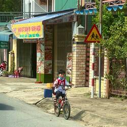 A young pioneer biking home from school