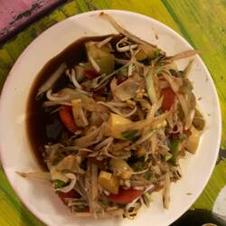 Issan (NE Thai) version of papaya salad with forest snails, which are super tough & chewy. 🤢