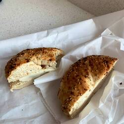 My last bagel breakfast in New York - an everything bagel with cream cheese at LaGuardia.