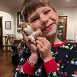 Santa came & brought Holden a toy hamster.