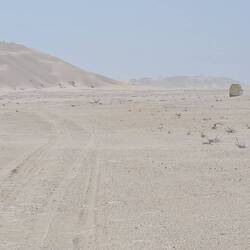 Endless tracks, sand and dust