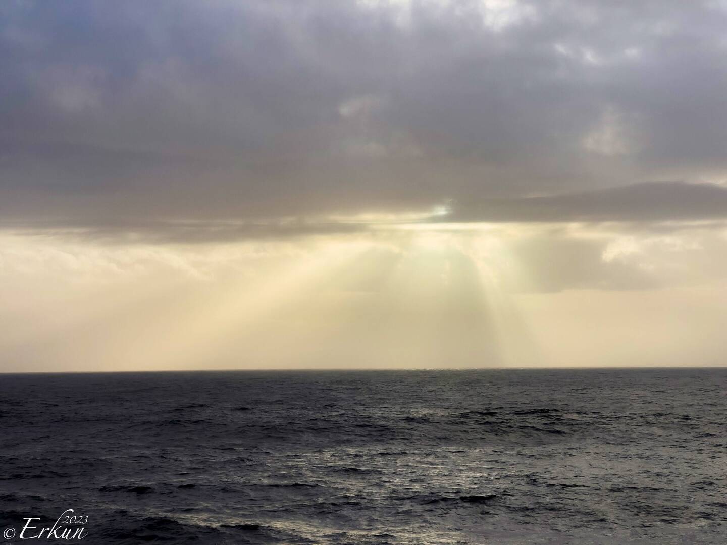 Crepuscular rays before sunset — Aboard Insignia.