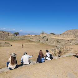 The start of exploring Monte Alban. Here Moses is showing the animal sacrifice area.