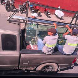 Let's ride in the back of a truck with a pane of glass...