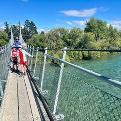 on the suspension bridge at the start of the flat hike